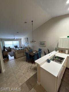 3685 Stone Way Estero, FL 33928 - Photo 5 of 27 a kitchen with a stove a kitchen island a sink and a refrigerator