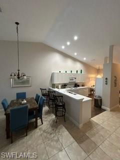 3685 Stone Way Estero, FL 33928 - Photo 9 of 27 a large kitchen with a table and chairs