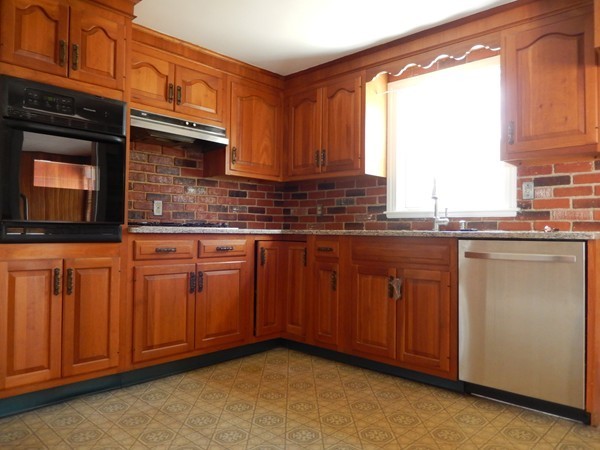 1 Kingsbury Road Canton, MA 02021 - Photo 4 of 15 a kitchen with granite countertop cabinets stainless steel appliances a sink and a window
