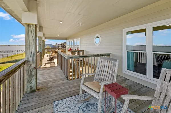 a bathroom with a toilet and a shower curtain