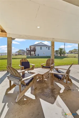 a bathroom with a sink a toilet and shower curtain
