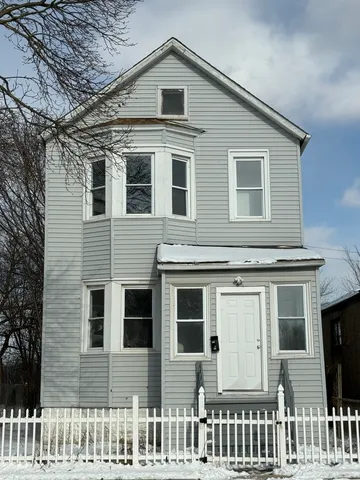 a front view of a house with a porch