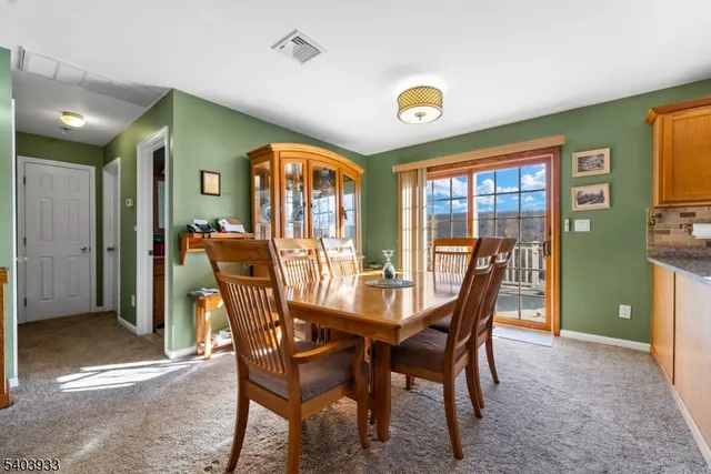 a kitchen with stainless steel appliances granite countertop a refrigerator stove and sink