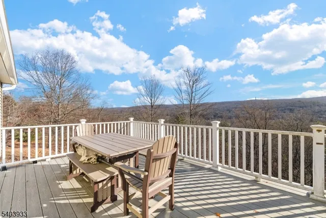 a view of a balcony with wooden floor