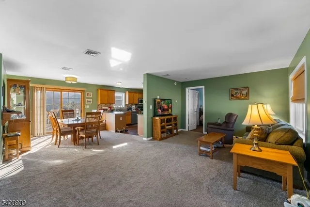 a living room with furniture and large window