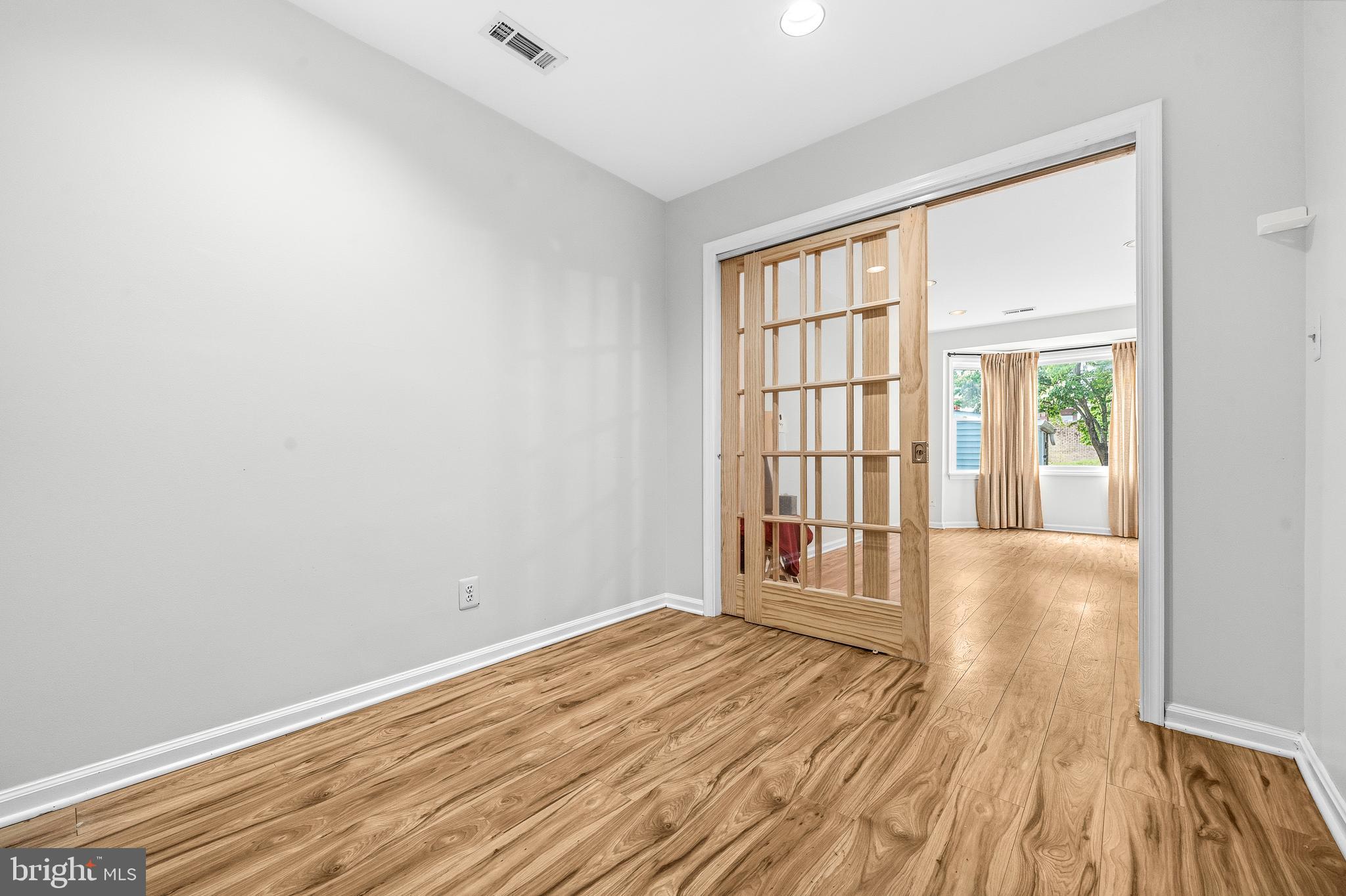 6001 Rabbit Hill Court Centreville, VA 20121 - Photo 17 of 46 wooden floor in an empty room with a window