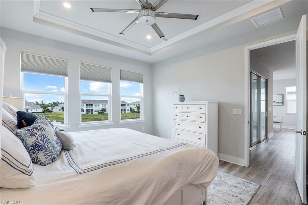 4705 Arboretum Circle, Unit 203 Naples, FL 34112 - Photo 14 of 31 a bedroom with a large bed and a large window