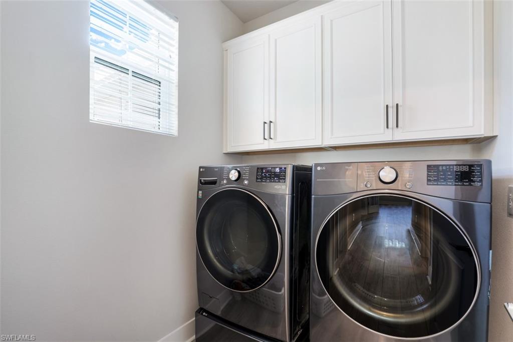 4705 Arboretum Circle, Unit 203 Naples, FL 34112 - Photo 20 of 31 a utility room with dryer and washer
