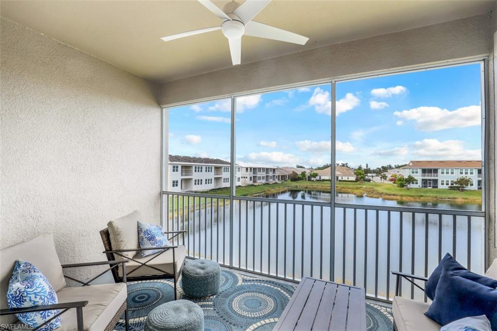 4705 Arboretum Circle, Unit 203 Naples, FL 34112 - Photo 21 of 31 a view of a chair and tables in the balcony