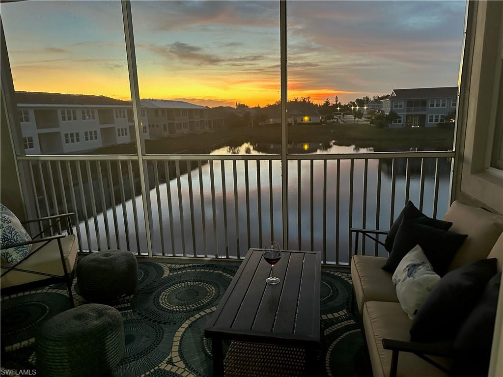 4705 Arboretum Circle, Unit 203 Naples, FL 34112 - Photo 24 of 31 a balcony with wooden floor