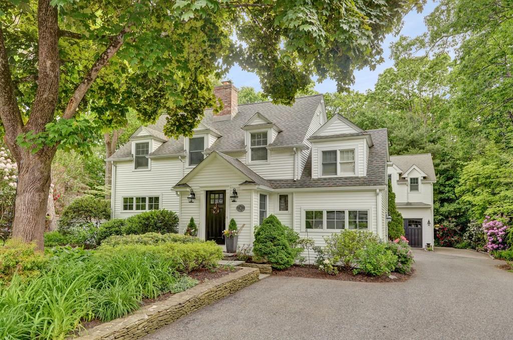 9 Madison Road Wellesley, MA 02481 - Photo 1 of 40 a front view of a house with a yard and trees