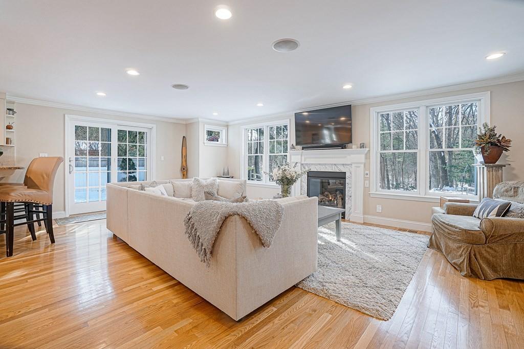 9 Madison Road Wellesley, MA 02481 - Photo 11 of 40 a living room with fireplace furniture and a wooden floor