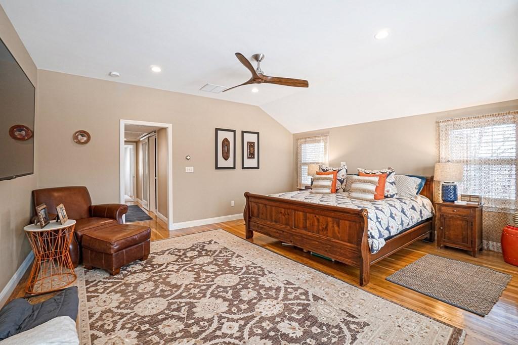 9 Madison Road Wellesley, MA 02481 - Photo 15 of 40 a bedroom with a bed and wooden floor