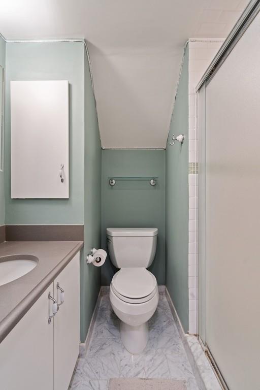 9 Madison Road Wellesley, MA 02481 - Photo 18 of 40 a bathroom with a toilet a sink and mirror