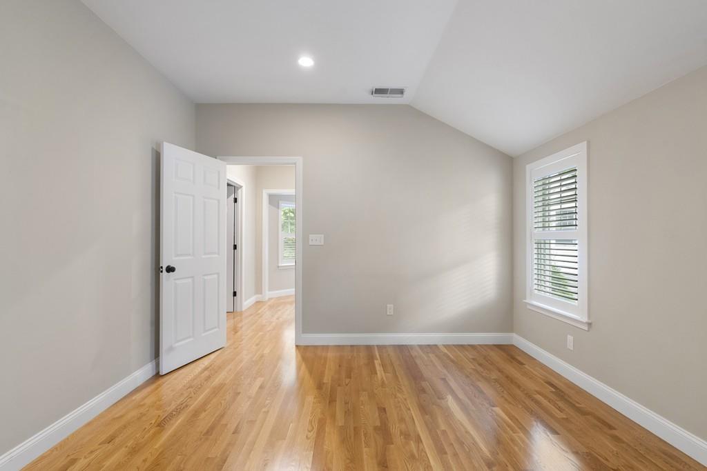 9 Madison Road Wellesley, MA 02481 - Photo 19 of 40 an empty room with wooden floor and windows