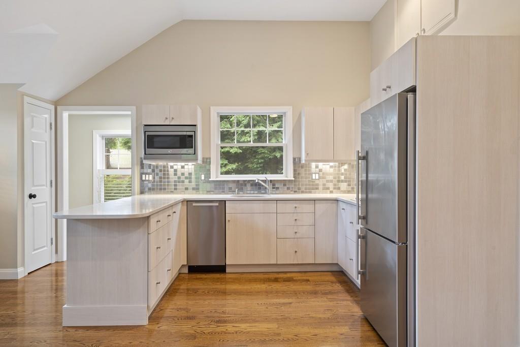 9 Madison Road Wellesley, MA 02481 - Photo 25 of 40 a kitchen with granite countertop cabinets appliances and a window