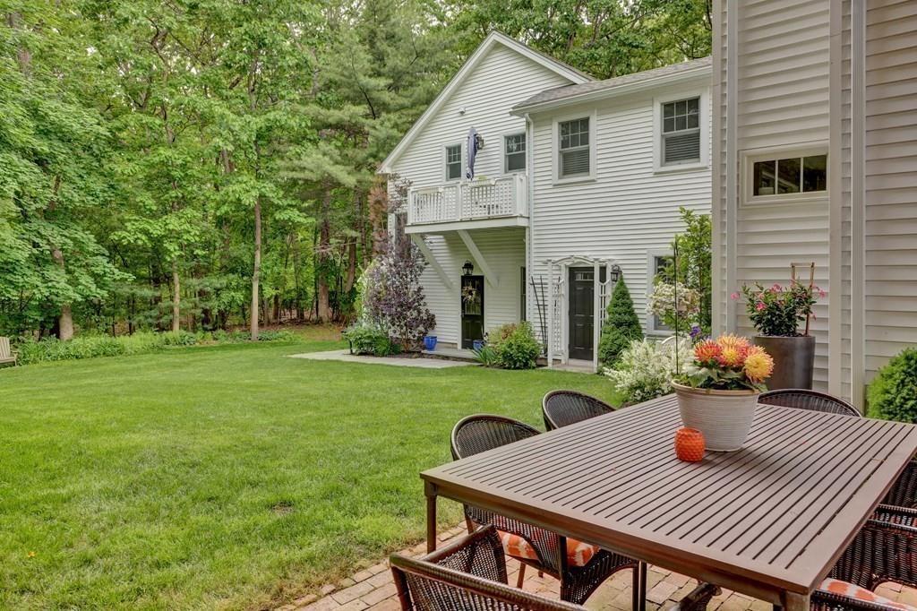 9 Madison Road Wellesley, MA 02481 - Photo 35 of 40 a view of a patio with table and chairs potted plants and large tree