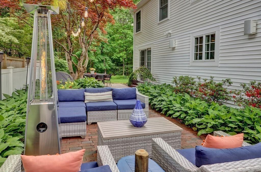 9 Madison Road Wellesley, MA 02481 - Photo 36 of 40 a view of a patio with couches chairs potted plants and a potted plant