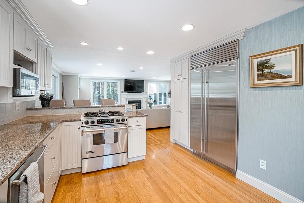 9 Madison Road Wellesley, MA 02481 - Photo 8 of 40 a kitchen with stainless steel appliances granite countertop a stove a refrigerator and a sink