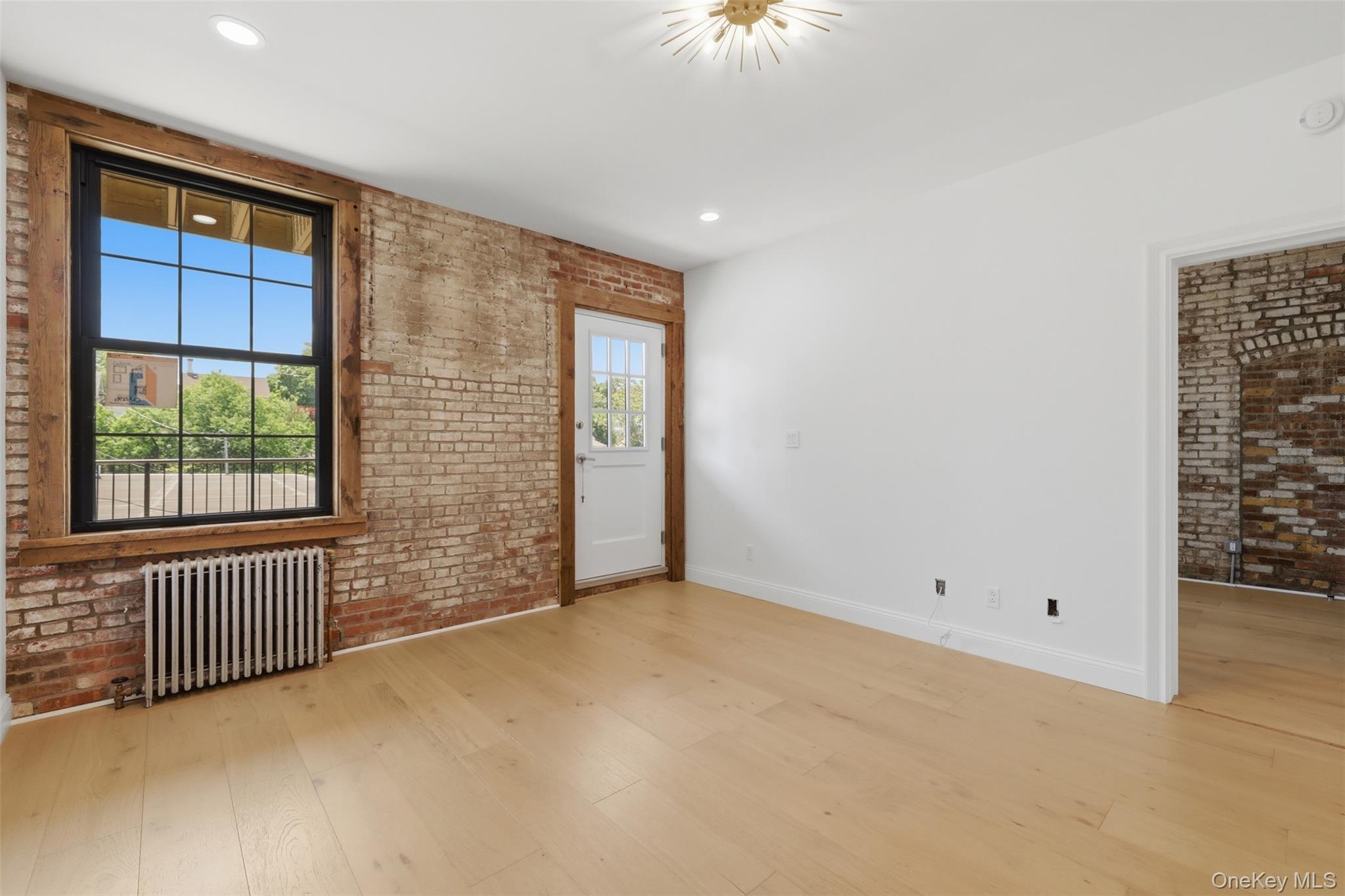 207 Main Street, Unit 5 Beacon, NY 12508 - Photo 9 of 20 an empty room with windows