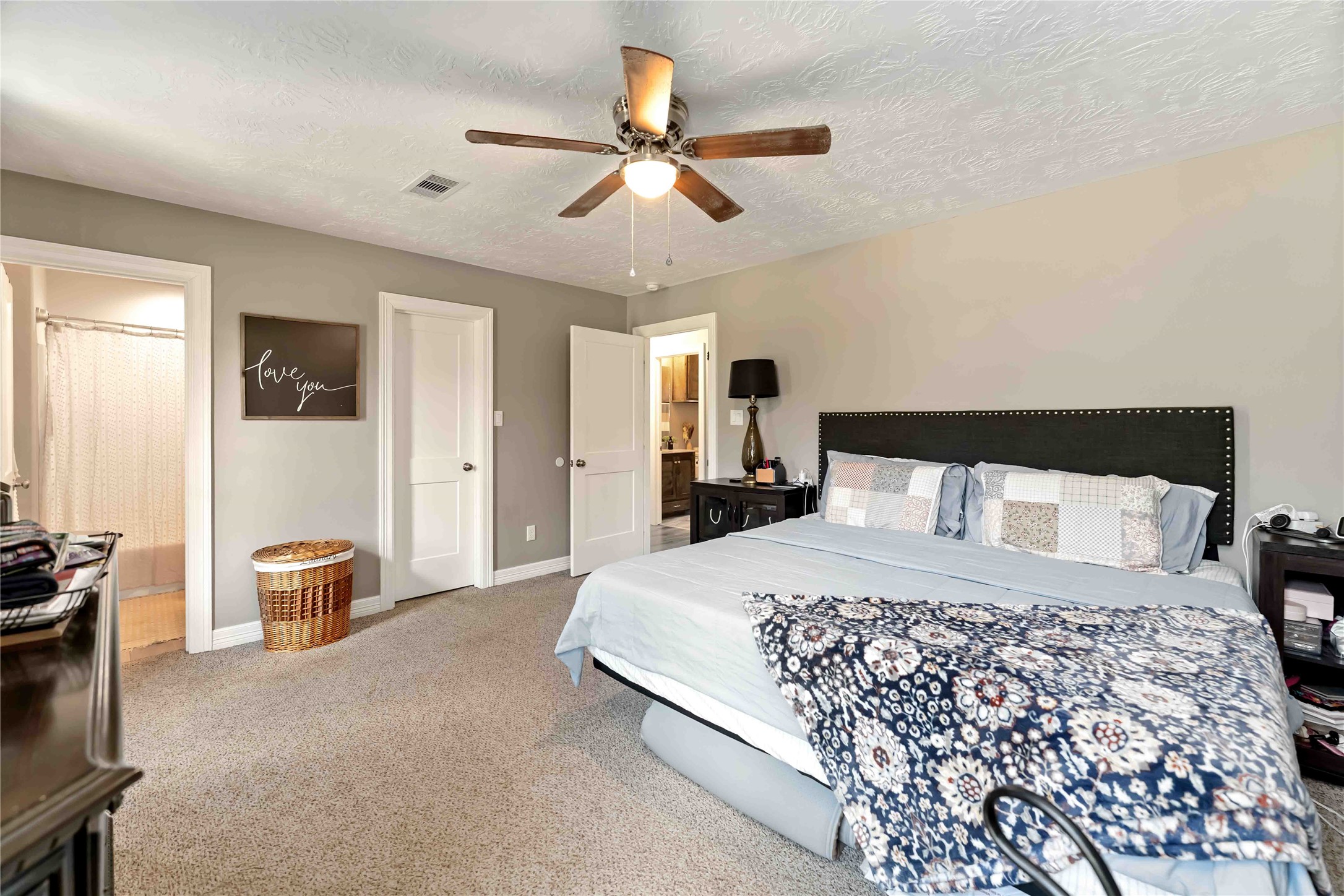 2615 Commerce Street Liverpool, TX 77577 - Photo 11 of 23 a large bedroom with a bed and furniture