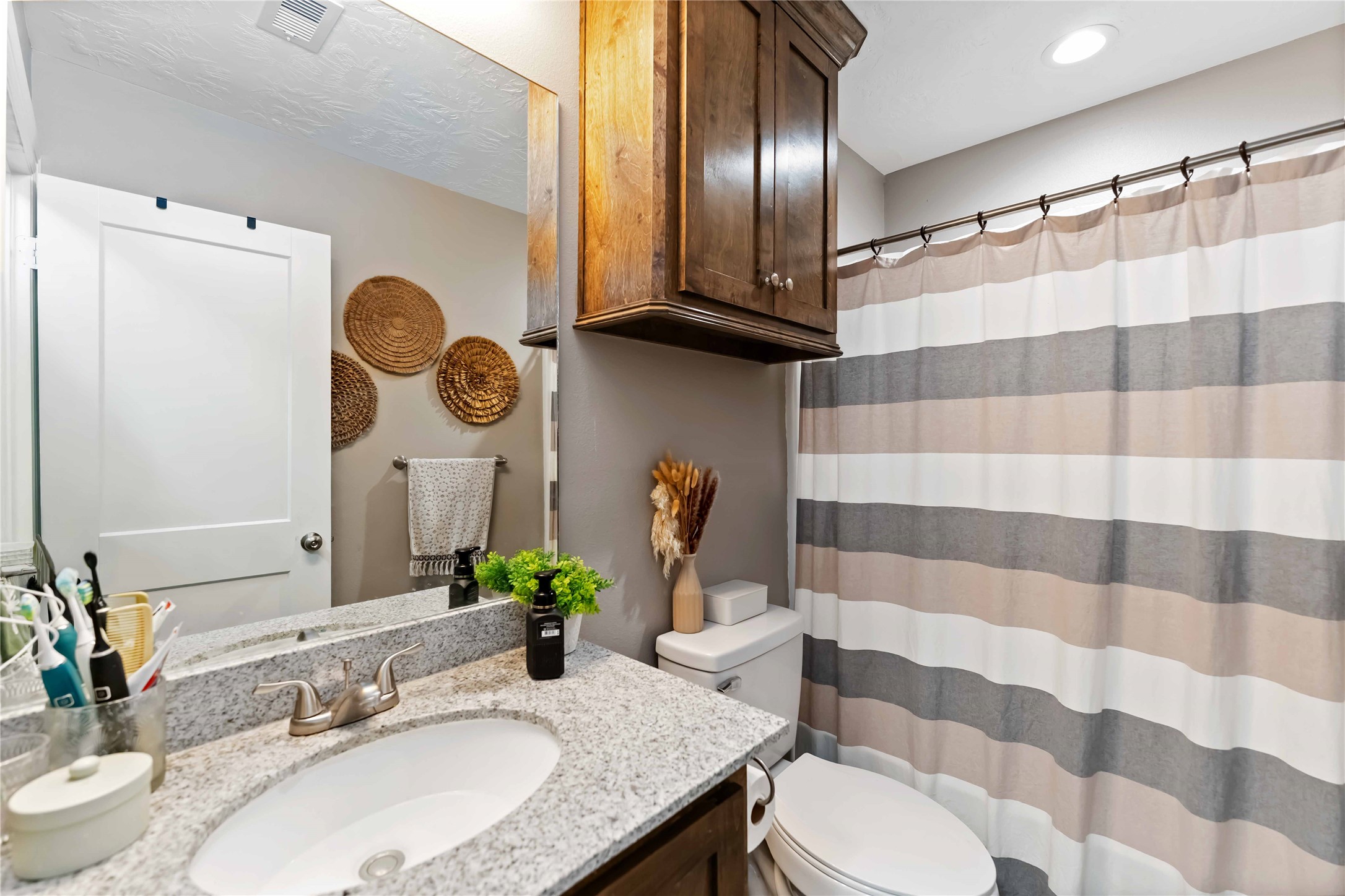 2615 Commerce Street Liverpool, TX 77577 - Photo 12 of 23 a bathroom with a sink toilet and shower