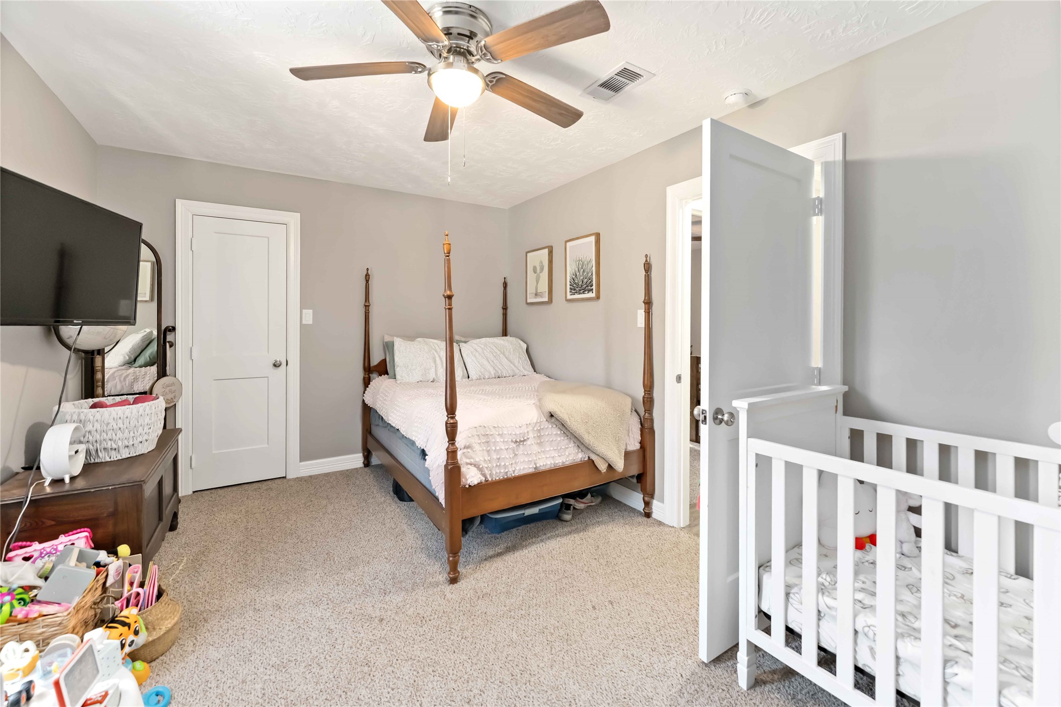 2615 Commerce Street Liverpool, TX 77577 - Photo 13 of 23 a bedroom with a bed and a window
