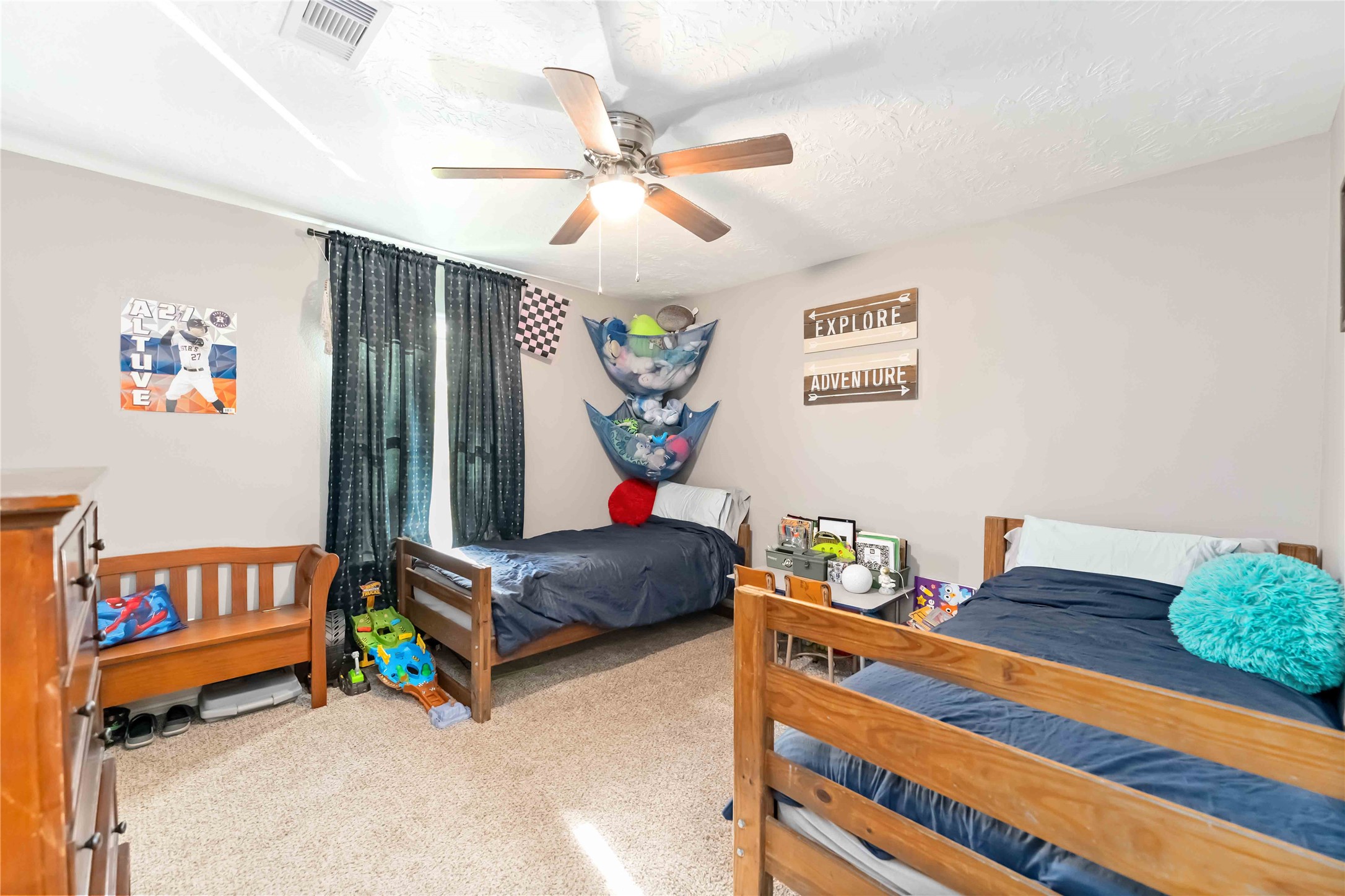2615 Commerce Street Liverpool, TX 77577 - Photo 15 of 23 a bedroom with a bed and a chandelier