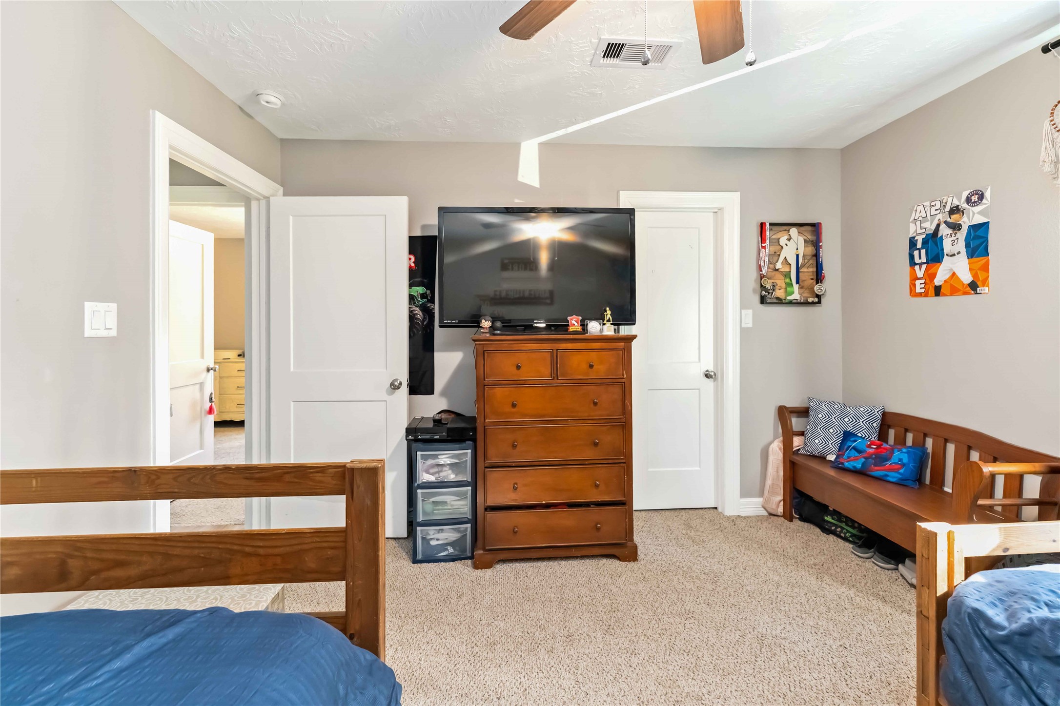 2615 Commerce Street Liverpool, TX 77577 - Photo 16 of 23 a living room with furniture and a flat screen tv