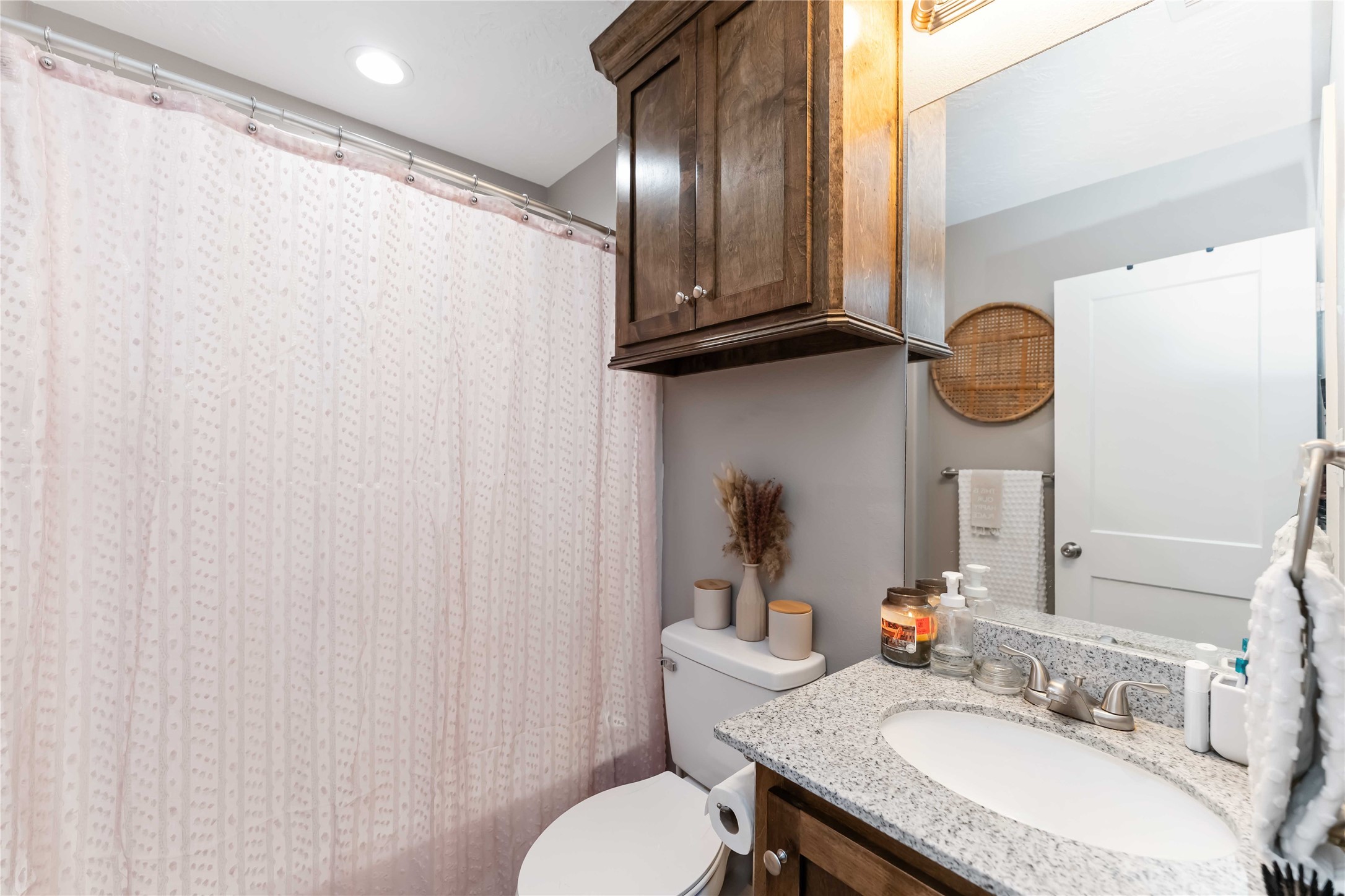 2615 Commerce Street Liverpool, TX 77577 - Photo 17 of 23 a bathroom with a granite countertop sink and a mirror