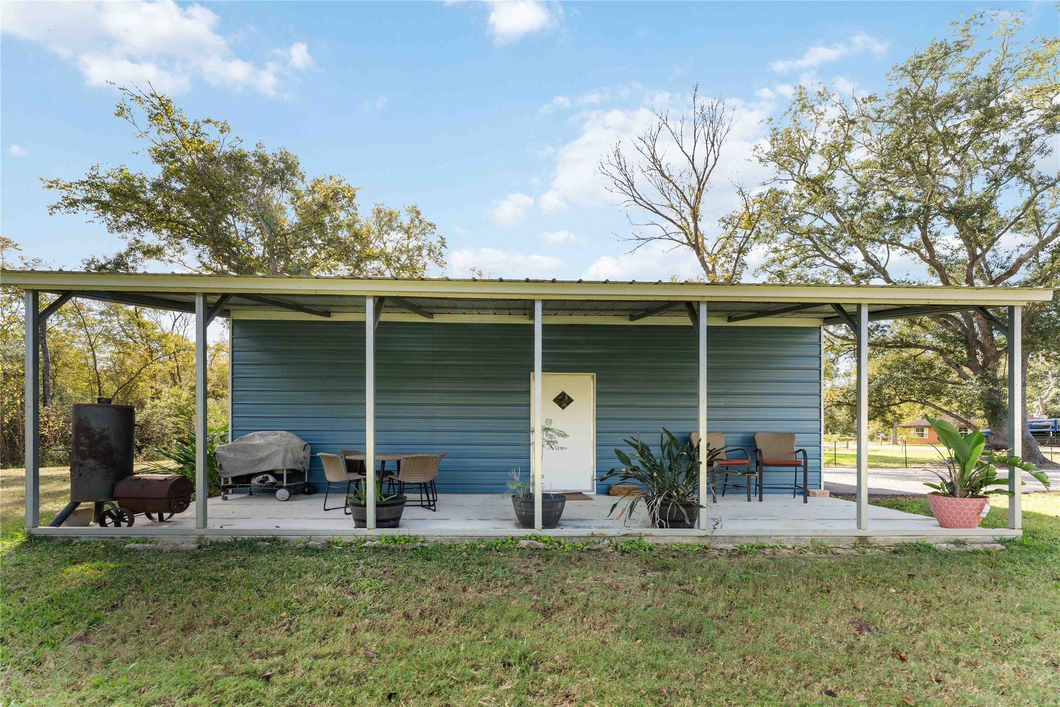 2615 Commerce Street Liverpool, TX 77577 - Photo 20 of 23 a view of a chair and table in backyard of house