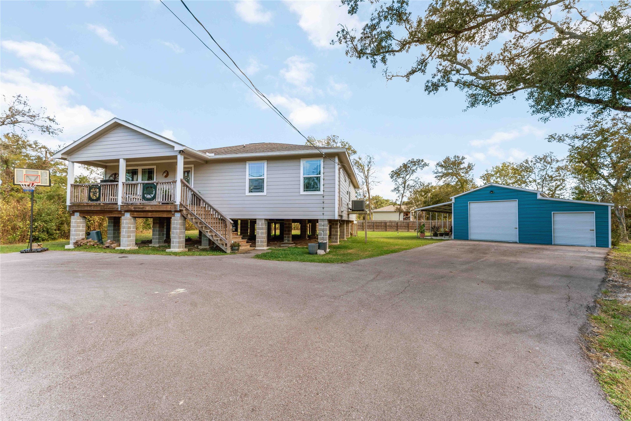 2615 Commerce Street Liverpool, TX 77577 - Photo 2 of 23 a front view of a house with a yard and garage