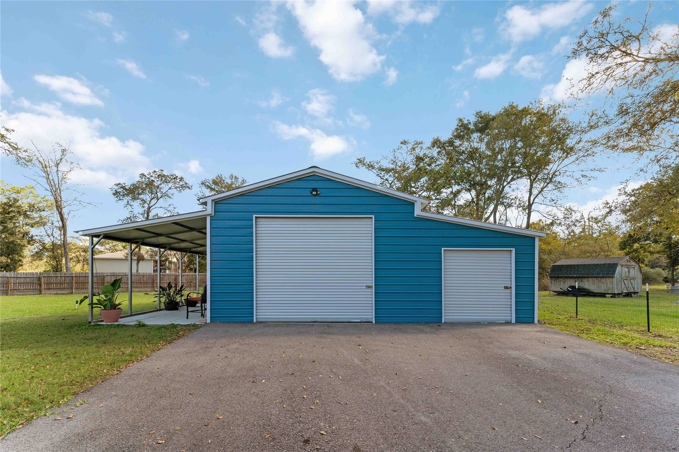 2615 Commerce Street Liverpool, TX 77577 - Photo 3 of 23 a front view of a house with a yard and garage