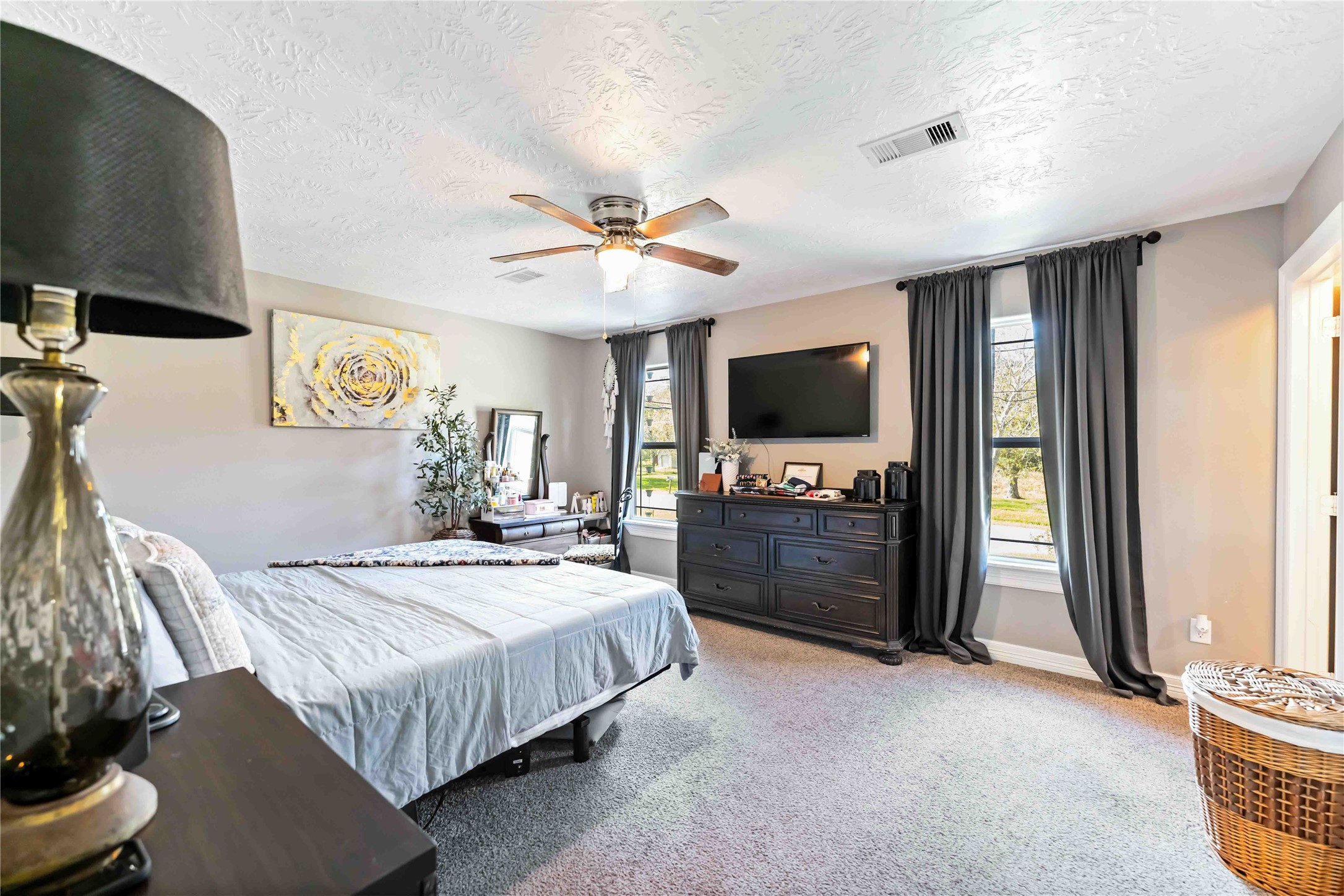 2615 Commerce Street Liverpool, TX 77577 - Photo 10 of 23 a bedroom with a bed and a flat screen tv