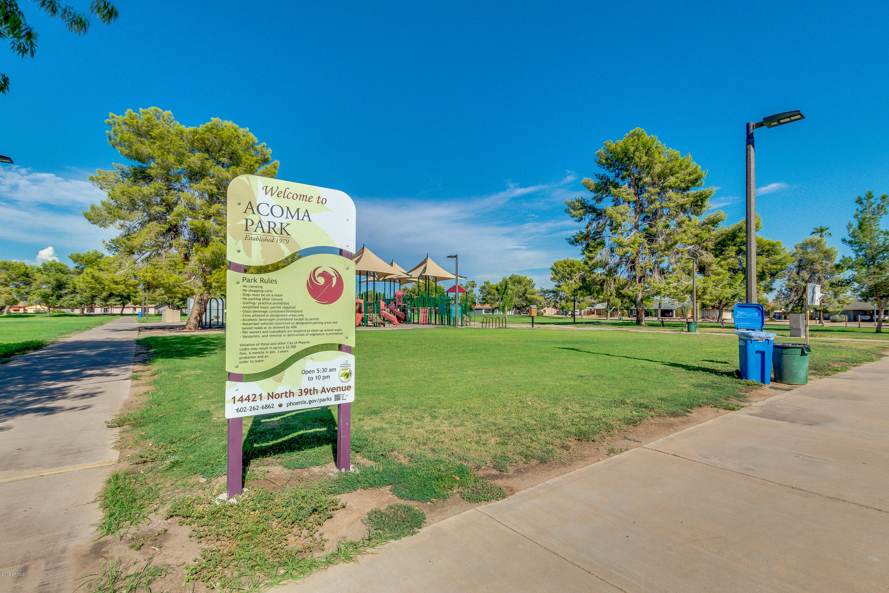 3622 West Hearn Road Phoenix, AZ 85053 - Photo 42 of 42 a bench sitting in the middle of a park