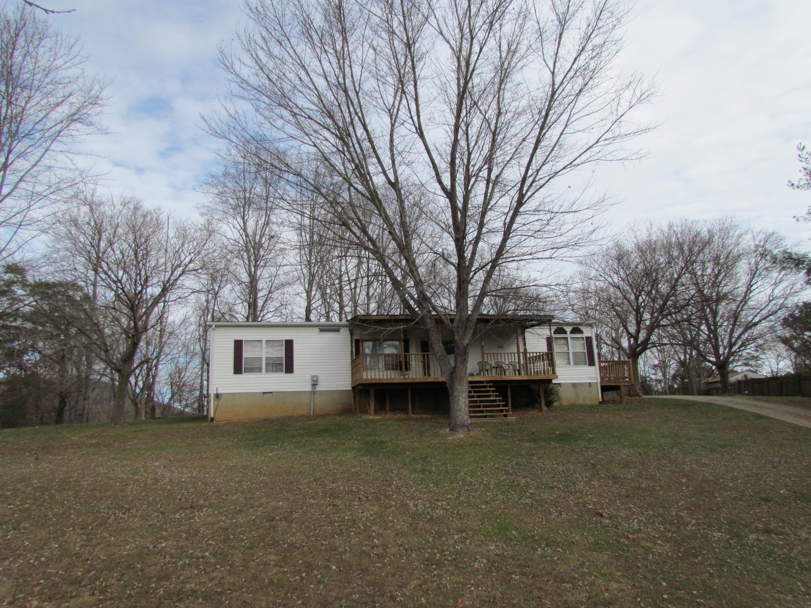 109 Westgrove Road Blue Ridge, VA 24064 - Photo 1 of 14 a view of a house with a large tree