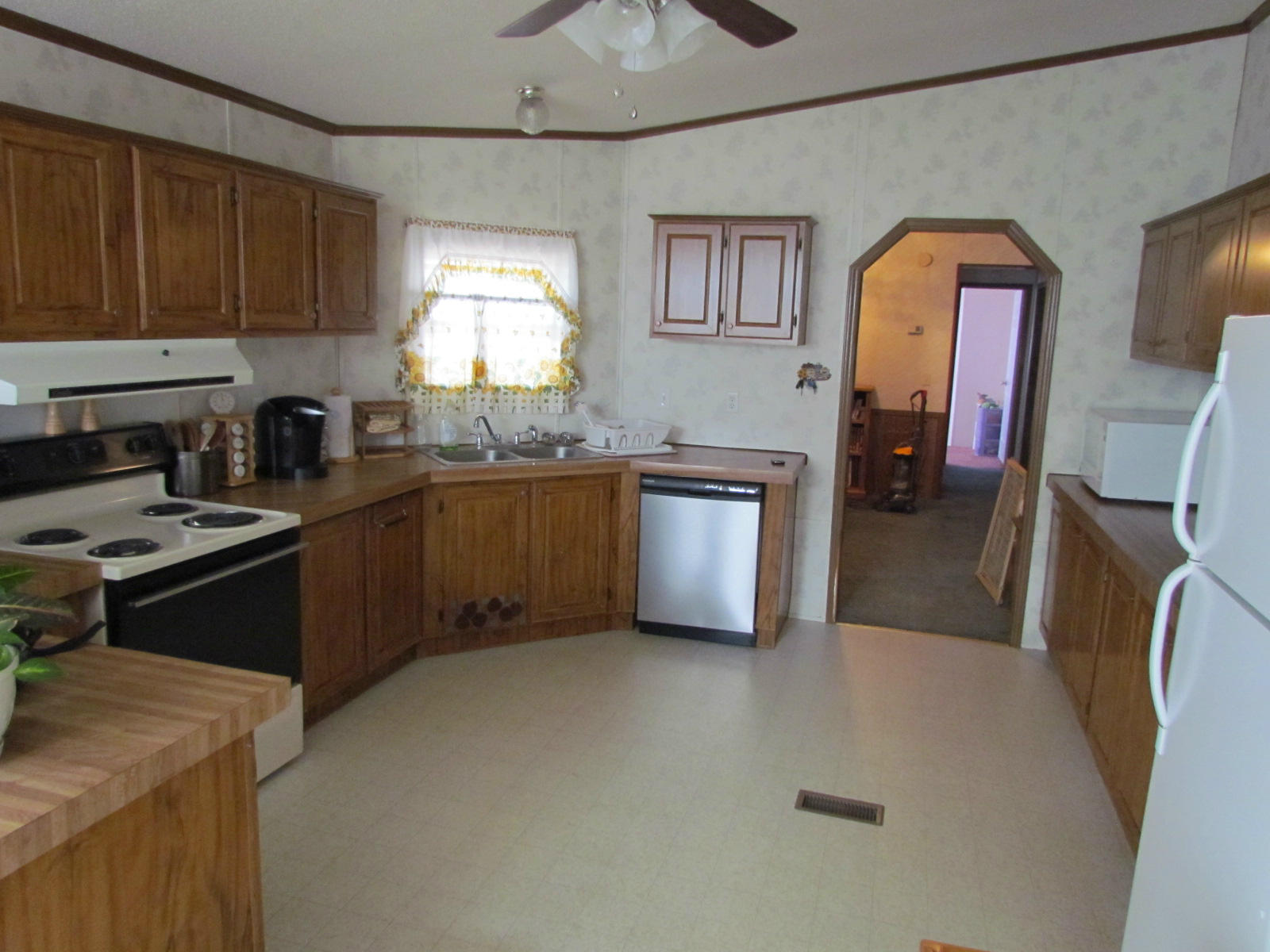 109 Westgrove Road Blue Ridge, VA 24064 - Photo 3 of 14 a kitchen with stainless steel appliances granite countertop a sink stove and refrigerator