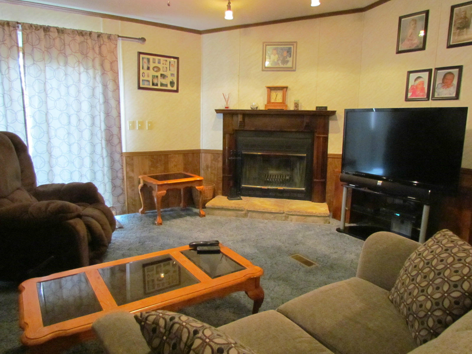 109 Westgrove Road Blue Ridge, VA 24064 - Photo 7 of 14 a living room with furniture a flat screen tv and a fireplace