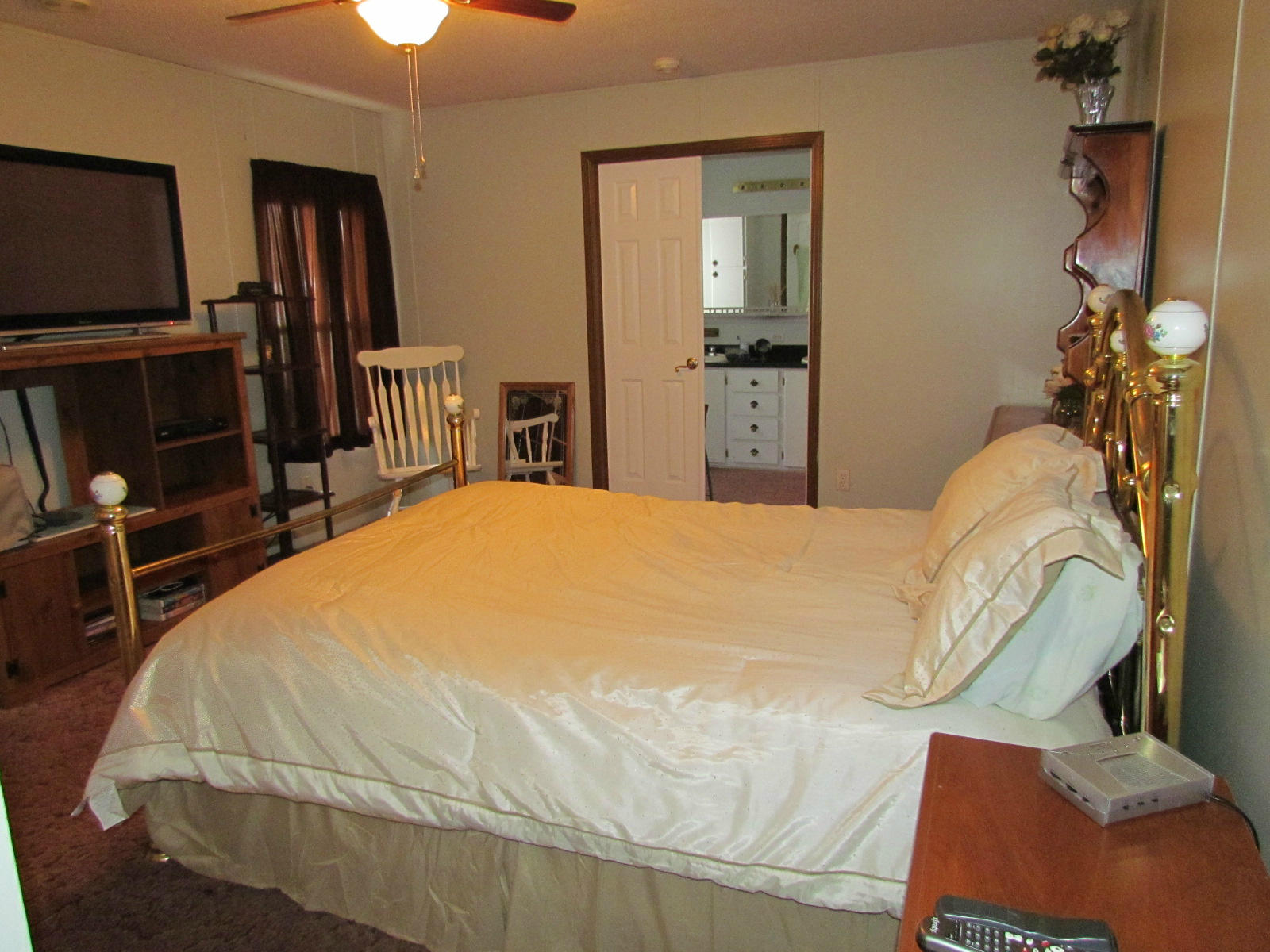 109 Westgrove Road Blue Ridge, VA 24064 - Photo 10 of 14 a large bed sitting in a bedroom and mirror