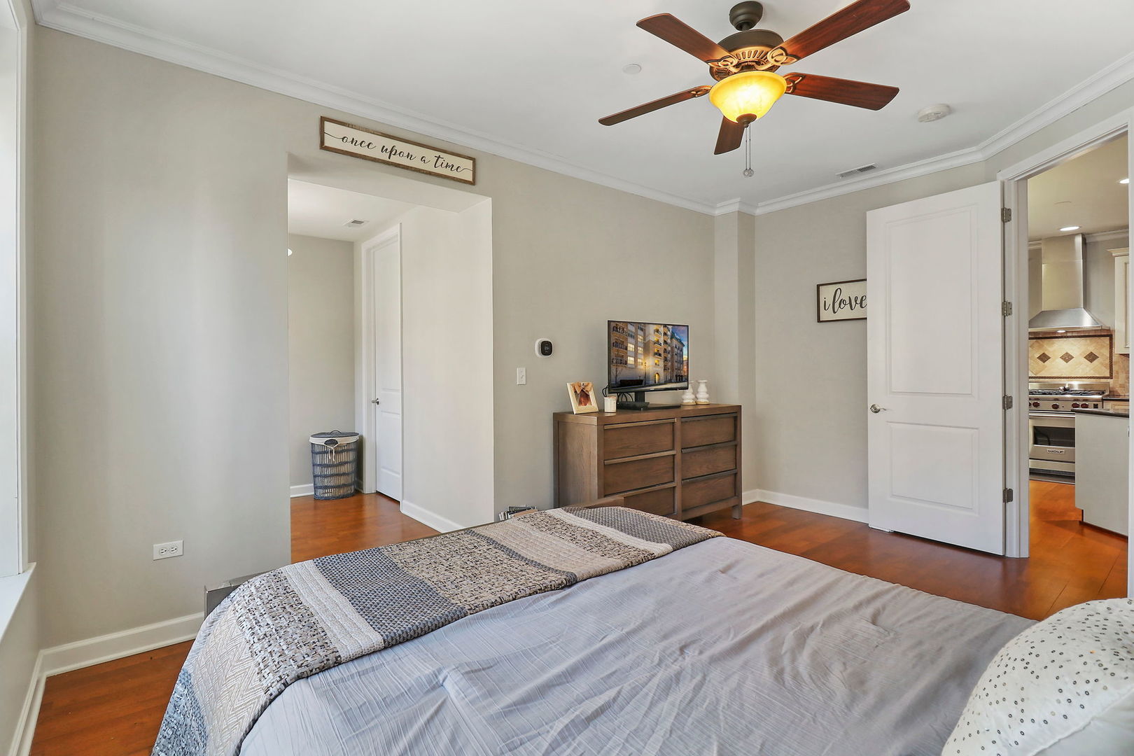 50 North Plum Grove Road, Unit 201E Palatine, IL 60067 - Photo 11 of 22 a bedroom with a bed and a chandelier