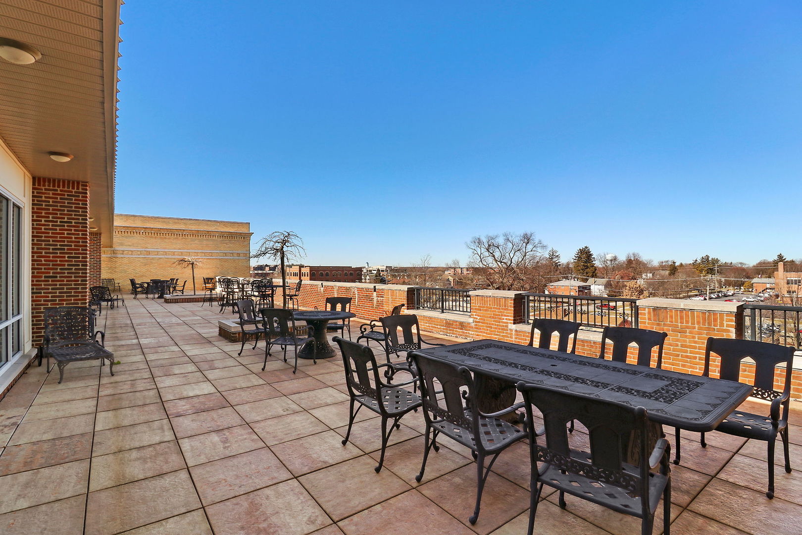 50 North Plum Grove Road, Unit 201E Palatine, IL 60067 - Photo 18 of 22 a view of a terrace with furniture