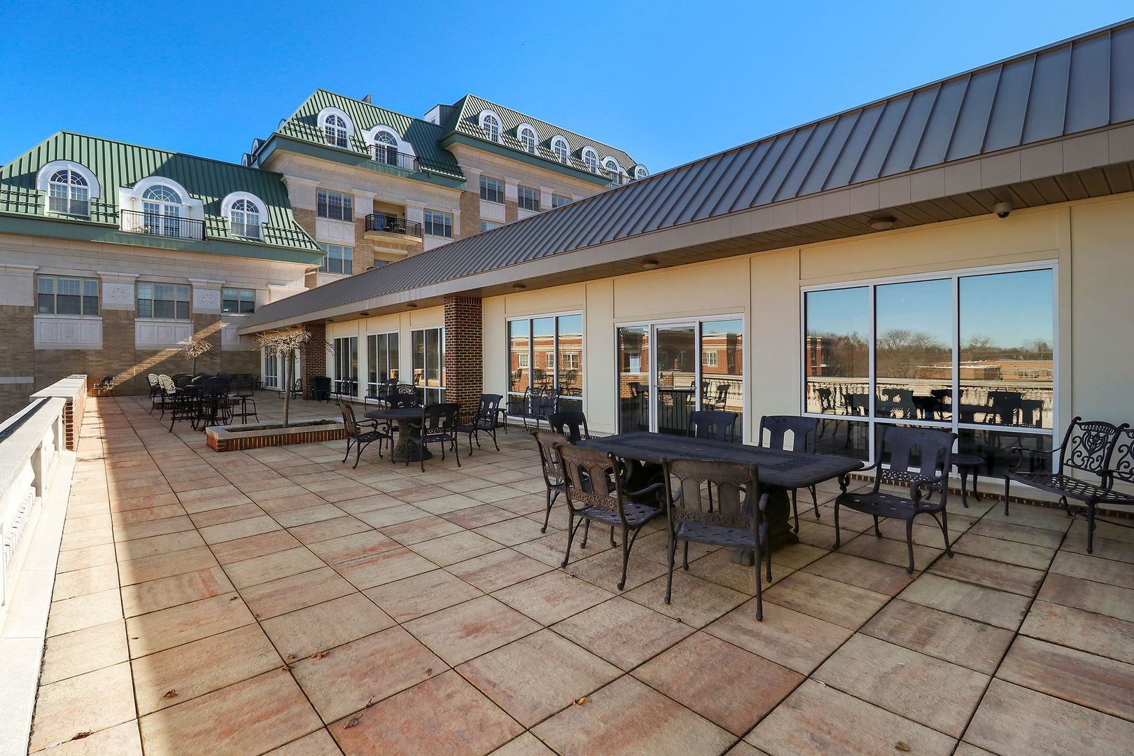 50 North Plum Grove Road, Unit 201E Palatine, IL 60067 - Photo 19 of 22 a view of a patio with table and chairs