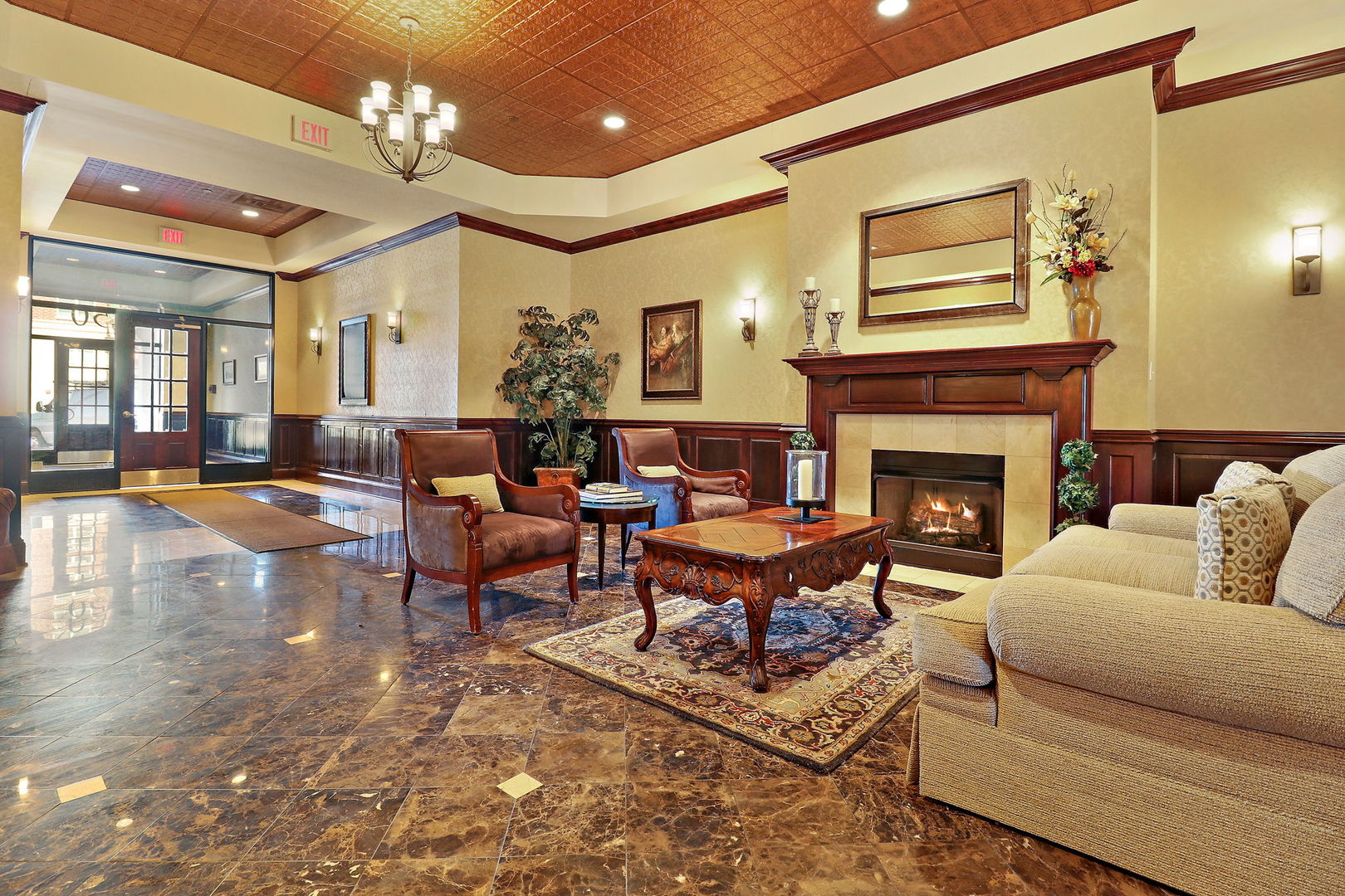50 North Plum Grove Road, Unit 201E Palatine, IL 60067 - Photo 21 of 22 a living room with furniture fireplace and a fireplace