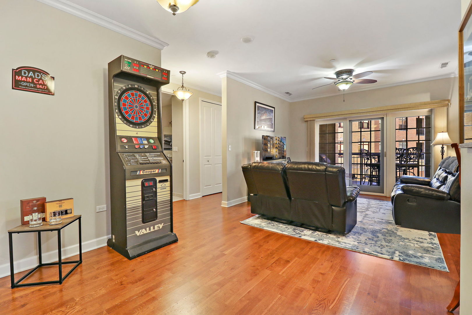 50 North Plum Grove Road, Unit 201E Palatine, IL 60067 - Photo 3 of 22 a living room with furniture and a flat screen tv