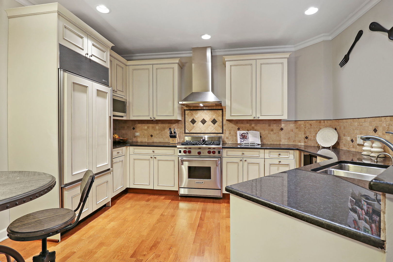 50 North Plum Grove Road, Unit 201E Palatine, IL 60067 - Photo 4 of 22 a kitchen with a stove a sink and a refrigerator