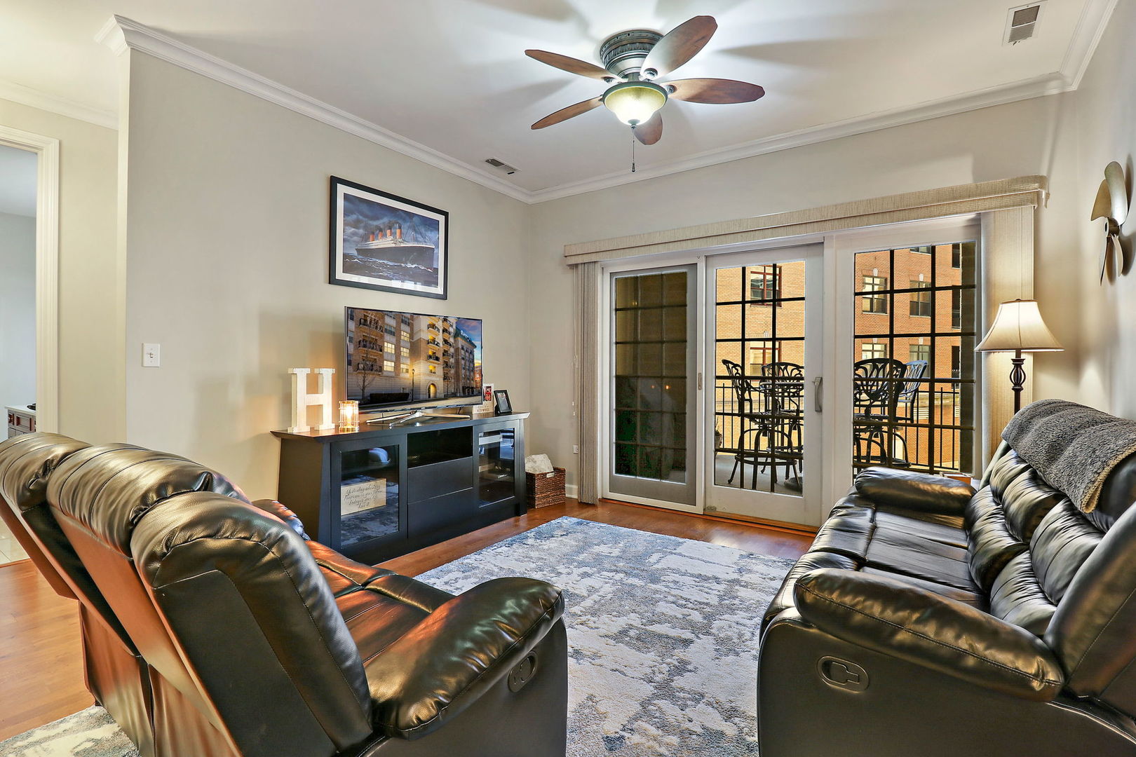 50 North Plum Grove Road, Unit 201E Palatine, IL 60067 - Photo 7 of 22 a living room with furniture and a floor to ceiling window