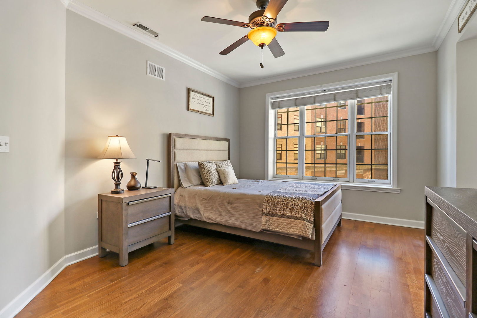 50 North Plum Grove Road, Unit 201E Palatine, IL 60067 - Photo 10 of 22 a bedroom with a bed and wooden floor