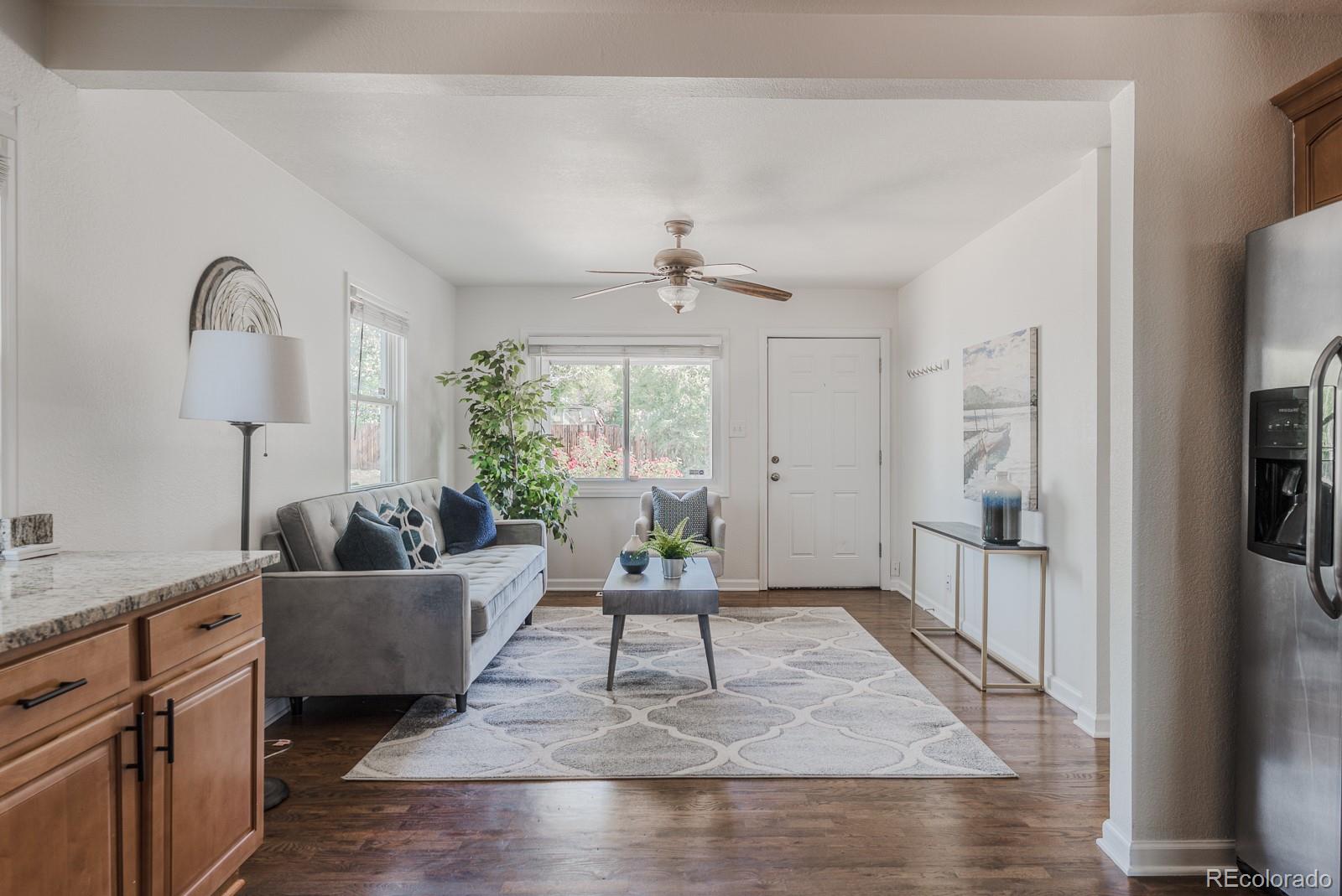 2260 Lilly Drive Thornton, CO 80229 - Photo 13 of 33 a living room with furniture and a window
