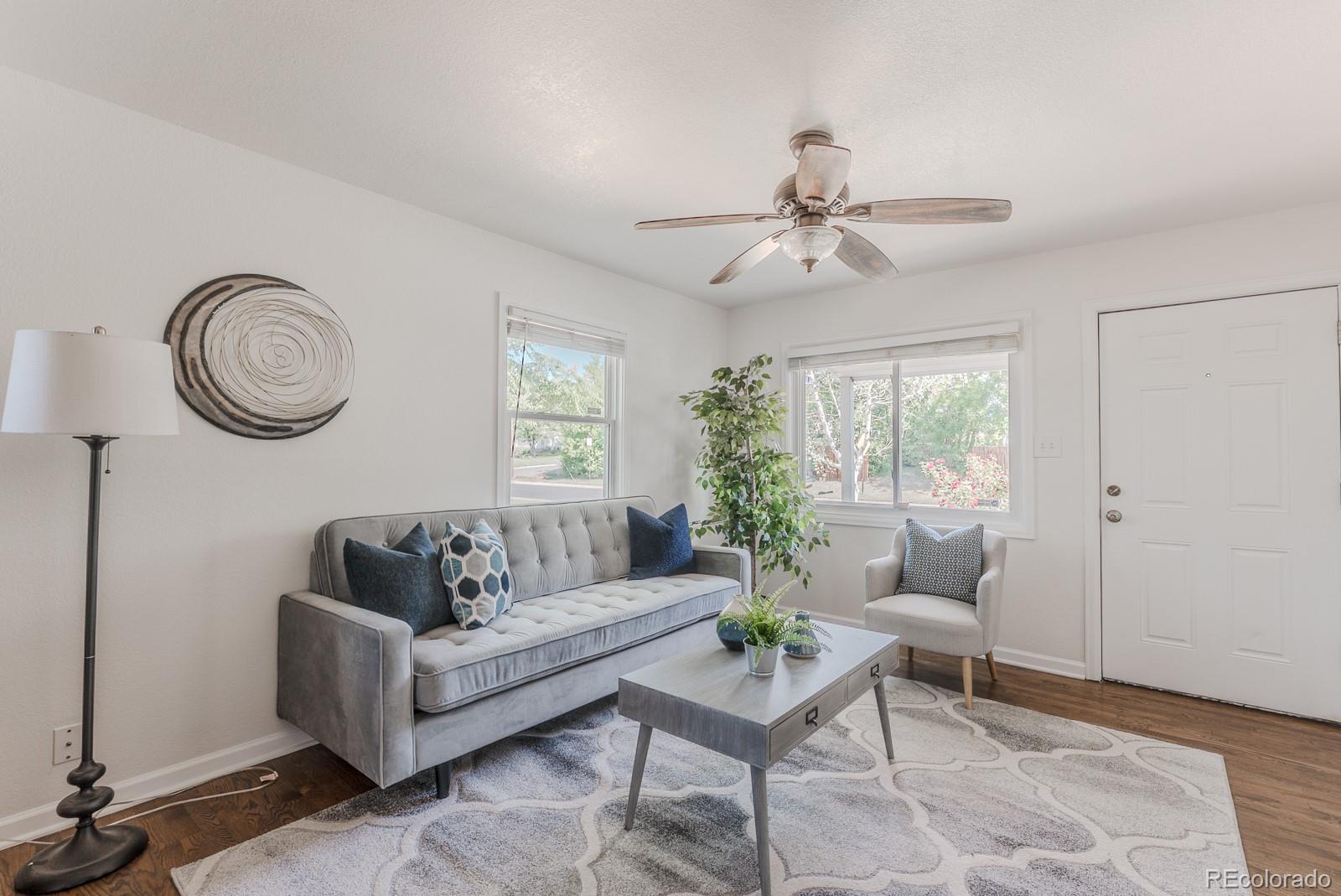 2260 Lilly Drive Thornton, CO 80229 - Photo 14 of 33 a living room with furniture and a window