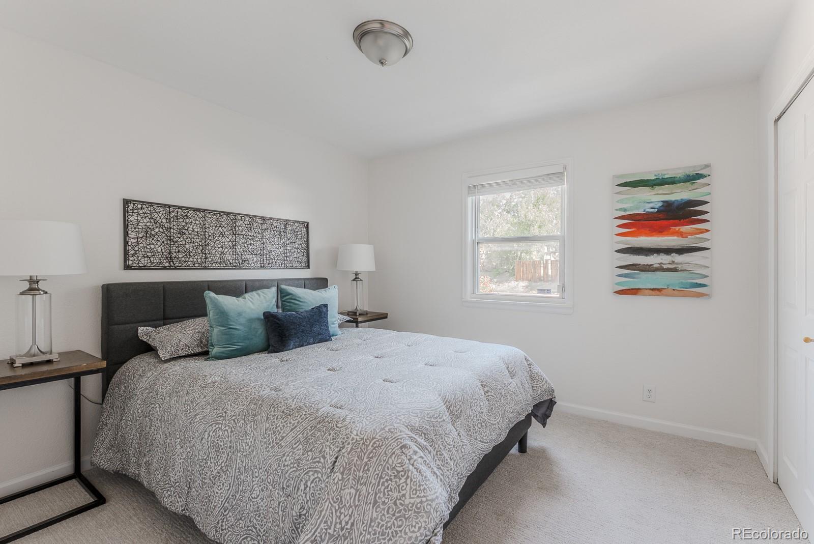 2260 Lilly Drive Thornton, CO 80229 - Photo 17 of 33 a bedroom with a bed and a window